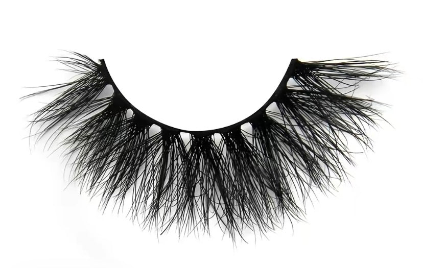 Pair of black false eyelashes on a white background