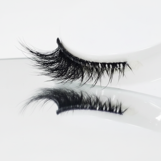 Pre-glued & no glue needed These self adhesive eyelashes come with a wide glue strip, making them no glue needed for easy application. Perfect for quick, hassle-free wear without messy adhesive.
Soft clear band for comfort Crafted with a handcrafted cotton band and transparent plastic strip, these lashes offer a soft, lightweight feel that blends naturally with your eye shape.
Winged cat eye style Designed as cat eye lashes with a winged style, these half lashes enhance your look with a dramatic, elegant fl